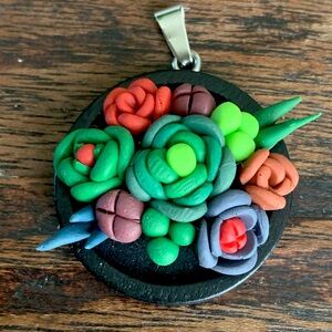 Handmade polymer clay pendant.